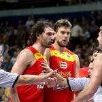 Spanish power forward Jorge Garbajossa and Marc Gasol (13) have a spat with Lithuanian forward Linas Kleiza. Photo by Ray Vyšniauskas.