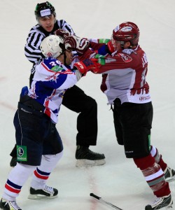 Maxim Ribin (left) and Miķelis Rēdlihs (right) go at it in second period. Photo used courtesy of Dinamo Riga.