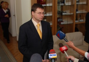 Latvian Prime Minister Valdis Dombrovskis announced Monday that his government would make the agreed-upon cuts, but exactly how it will do so has not been made public.