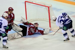 Martin Prusek makes a sparing dive to deny Leonid Koksharob the goal.