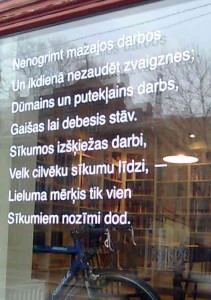 The window of the new 1/4 Sartori bookshop features a quote from the Latvian poet Rainis — the first three stanzas read "to not drown in the small tasks and not to lose stars in the everyday life." Photo by Didzis Melbiksis.