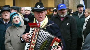 A Lithuanian pensioner performs an angry song about Prime Minister Andrius Kubilius and the austerity measures his government has introduced at Tuesday's protest. Photo by Nathan Greenhalgh.