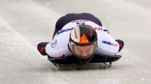 World champion Martins Dukurs slides down the track on his skeleton sled.