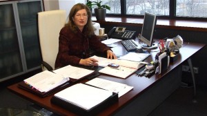 Inguna Sudraba sits at her desk in the state audit office. Photo used courtesy of Baltic Features.