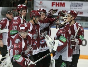 Goalie Edgars Masalskis is congratulated by team mates after securing a rare goal. Photo used courtesy of Dinamo Riga.