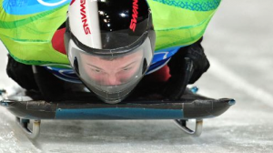 Martins Dukurs speeds down the track on his skeleton sled. Dukurs' second-place result disappointed those looking for Latvia's first-ever Winter Olympic gold, but his silver medal is nonetheless impressive.