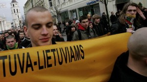 This nationalist skinhead is holding a poster saying "Lithuania for Lithuanians" during the March 11 parade down Gedimino Prospect. While the city government has never curtailed the far-right processions, it has bent over backwards to bar pro-gay rights events. Is Lithuania's tolerance of intolerance going too far?