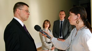 Latvian Prime Minister Valdis Dombrovskis (left) gets interviewed by a journalist. The Latvian media has been closely watching the unstable coalition's latest developments to see if the government is headed toward collapse. 