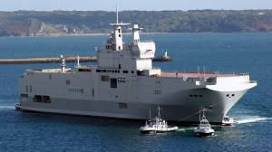 A Mistral ship gets tugged out of dock for a launch in France. A Russian naval official said that if Russia has possessed the ships in Aug. 2008 it could have defeated Georgia in 40 minutes.