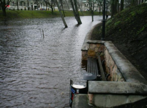 The enbankment of the Riga City Canal is underwater due to the large amount of melting snow combined with rain.
