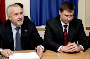 People's Party leader Andris Šķēle announces his party's pullout from the coalition with Prime Minister Valdis Dombrovskis (right) sitting next to him.