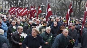 Marchers during the March 16, 2009 Legionnaires parade. Note that they're not holding Nazi flags, but Latvian ones.